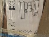 a cardboard box with a drawing of a computer desk in it