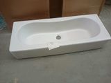 a white bath tub sitting on the floor in a room