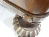 a close up of a wooden table with a glass top