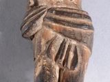 a statue of a man holding a bird on his back