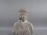 an image of a statue of a woman with a hat on