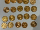 a lot of gold coins that are on the table