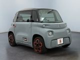 an image of a small electric car in a showroom