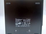 the back of a black laptop with buttons and numbers on it