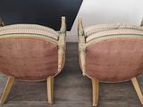 pair of mid century bamboo chairs with pink upholstered cushions