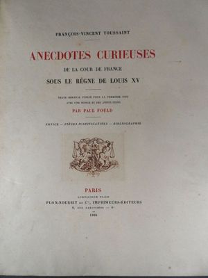 an old book with a picture of a dog on it ' s cover