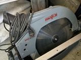 a picture of a circular blade saw in a garage