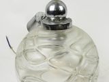 a glass ornament with a silver lid on a white background