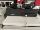 a computer sitting on top of a desk next to a keyboard