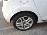 a close up of a car ' s tire on the street