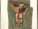 an image of a picture of a painting of a man ' s face on a piece of paper