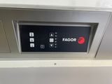a close up of a fagor logo on the side of a dishwasher