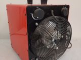an image of a red fan sitting on top of a white table