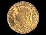 gros plan d'une pièce d'or sur fond noir