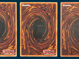 three cards with a picture of a black hole in the middle of them