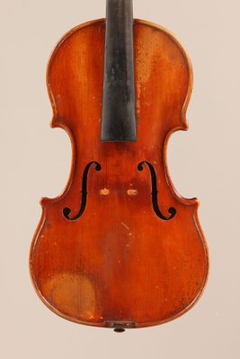 an old violin with a bow hanging from it ' s back
