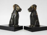 pair of bronze dog bookends on black marble bases