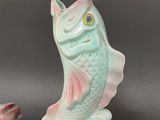 pair of ceramic fish salt and pepper shakers in pastel pink and green
