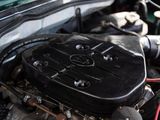 a car engine with the hood up and the hood down