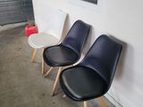 three chairs sitting next to each other in a room