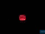 a red diamond on a black background