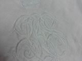 someone is drawing a design on a white shirt with a crown on it
