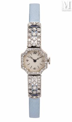 an image of a lady ' s wrist watch with diamonds and blue leather strap