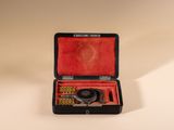 a black case with a pair of scissors inside of it
