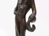 statue of a woman with a bird on her head and a bird on her shoulder