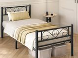 a bed with a metal frame in a room