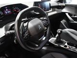the interior of a car with a steering wheel and dashboard controls