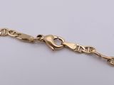 an image of a gold bracelet with a heart on it
