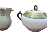two teapots that are sitting next to each other