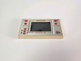 a close up of a small electronic device on a white surface