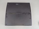 a black sony playstation game console sitting on a table