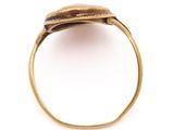 a close up of a gold ring with a stone in the middle
