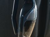 a black and silver vacuum sitting on a wooden table