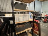 a room with a lot of shelves and chairs in it