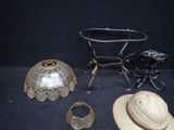 a hat, a lamp shade, and a hat on a table
