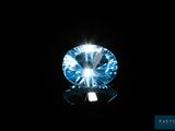 a close up of a blue diamond on a black background