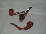 a picture of a pipe and a pipe holder on a table