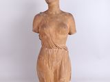 statue of a woman in a brown dress on a white background