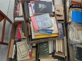 many boxes of books stacked on top of each other on the floor