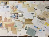 a suitcase full of letters and postcards sitting on a table