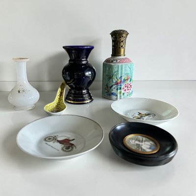 many different types of vases and bowls on the table