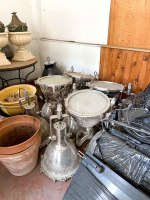 many pots and pans that are sitting on the floor