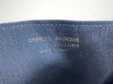 the back of a blue shirt with a small logo on it