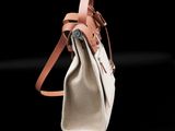 a close up of a purse with a strap on it