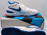 a pair of white and blue sneakers sitting on top of a box