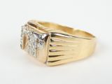 an image of a gold ring with three diamonds on it